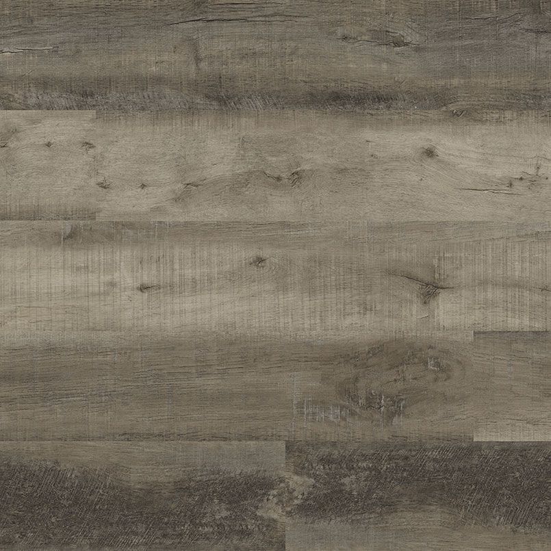 Close-up of a weathered, gray wood floor with visible grain and knots.