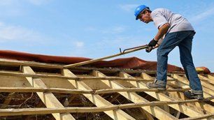 Worker repairing the roof