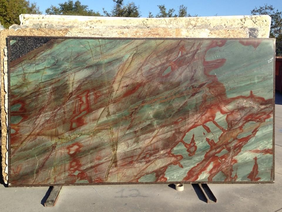 Green and red veined stone slab.