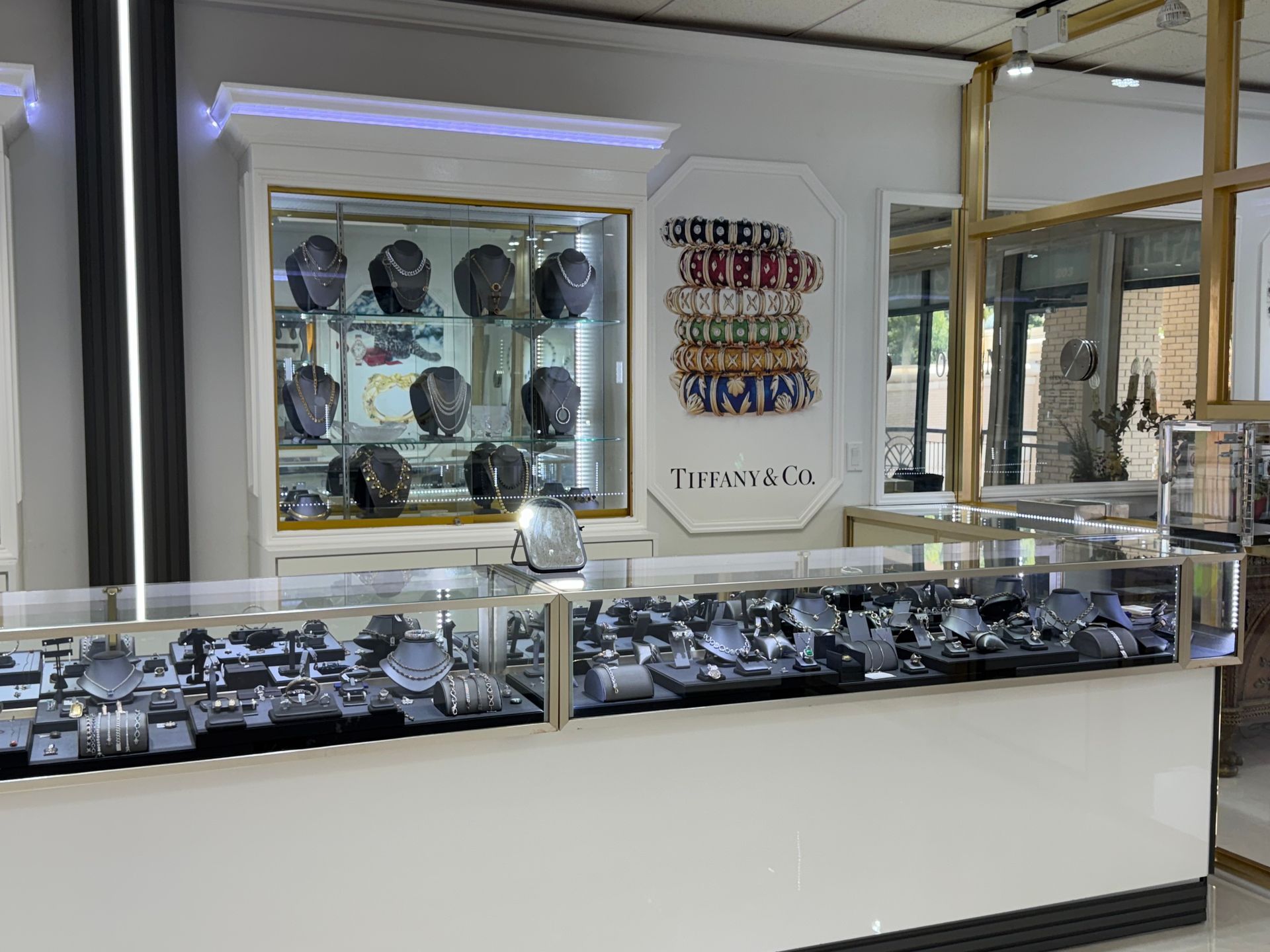 A jewelry store with a lot of jewelry on display.