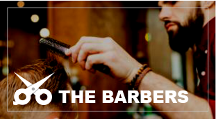 A man is getting his hair cut by a barber.