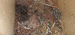 Copper wire scrap in a container.