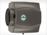 Gray wall-mounted hand dryer with a green circular logo on the front