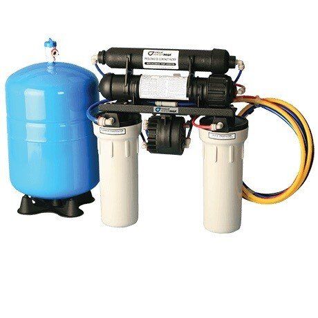 A water filter is sitting next to a blue tank.