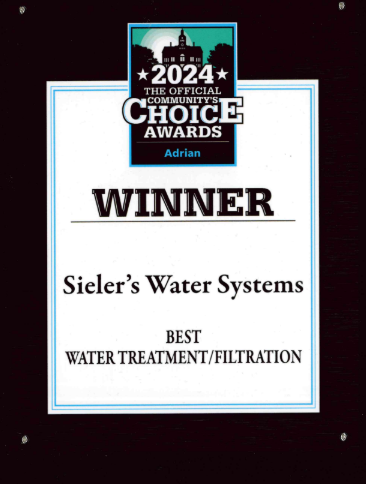 A sign that says winner sieler 's water systems best water treatment filtration