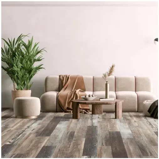 Living room with wooden floors, neutral-toned sofa, potted plant, and a coffee table.