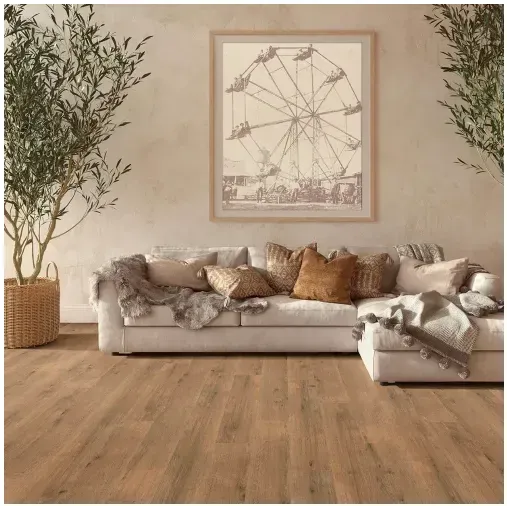 Living room with a beige couch, wooden floor, Ferris wheel art, and olive trees.