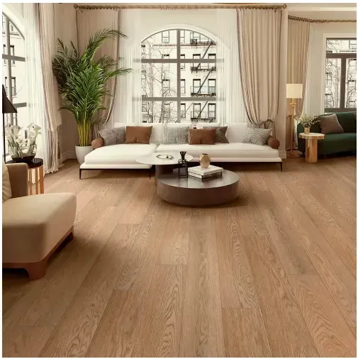 Living room with hardwood floors, white sofa, arched window, and large plant.