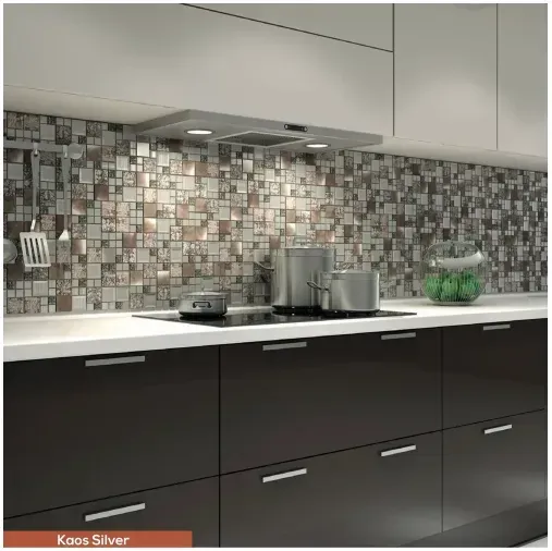 Modern kitchen with stainless steel appliances, mosaic tile backsplash, and dark cabinets.