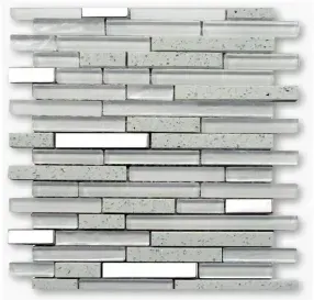 A mosaic tile with various shapes in white, clear, and speckled gray.