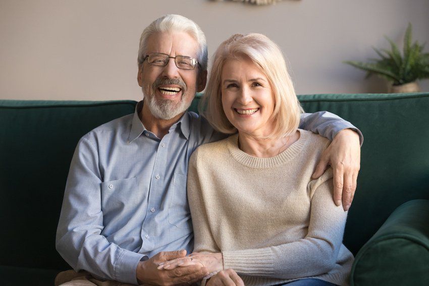 Smiling elderly couple