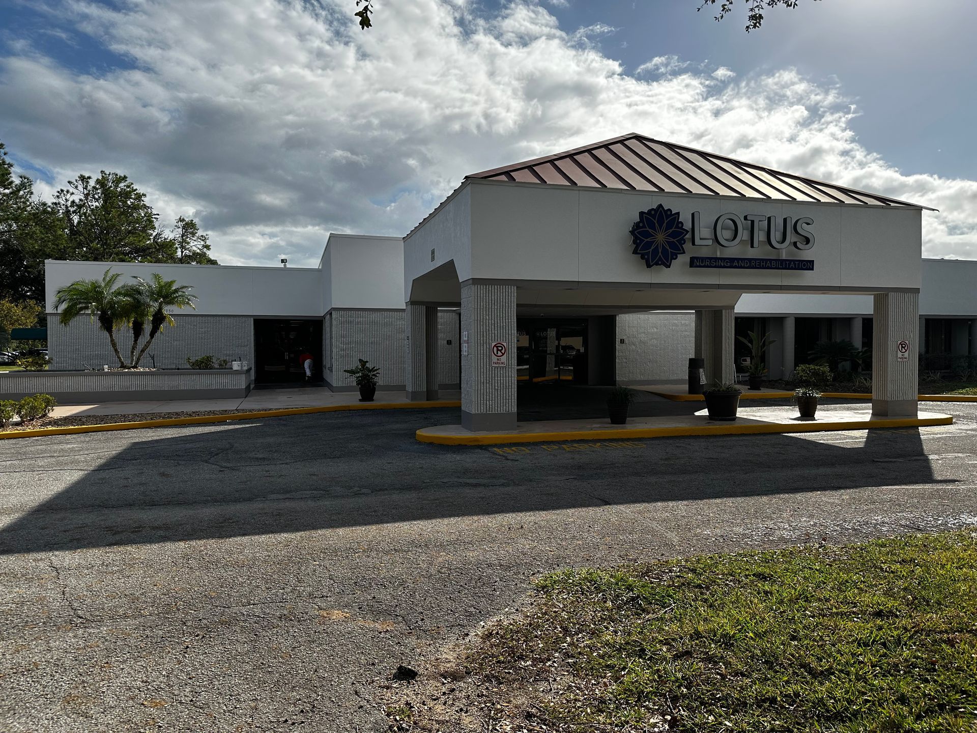 A large white building with the word lotus on it