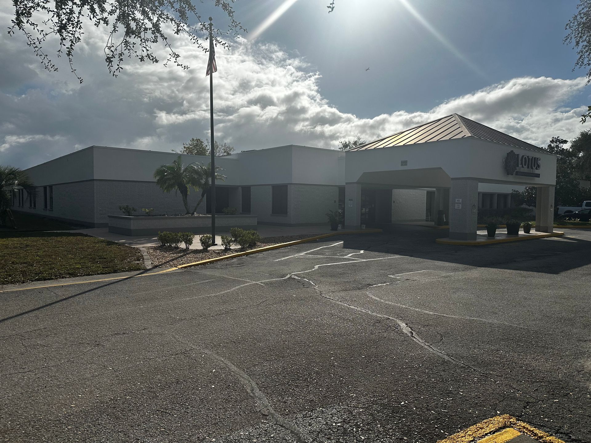 A large white building with a roof that says one on it