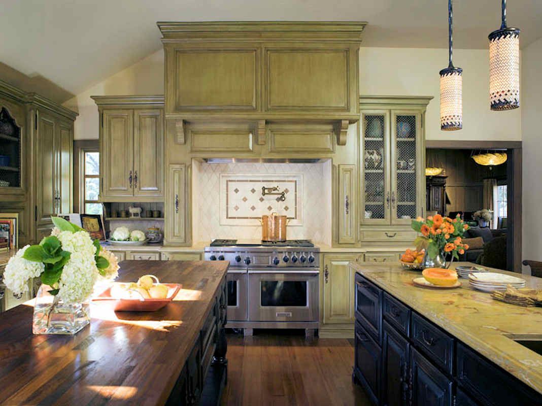 Spacious kitchen with wood cabinets, stainless steel appliances, and two islands.