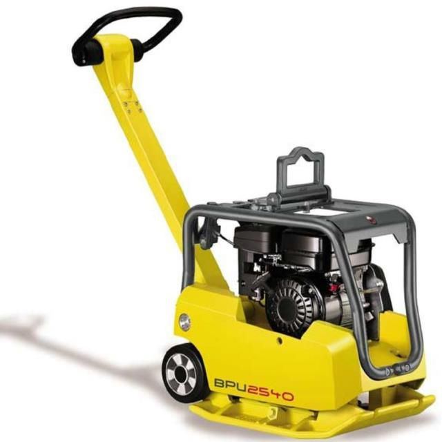 Yellow and black plate compactor with handle and wheels, on a white surface.