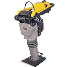 Yellow and gray Wacker Neuson rammer compactor on a black base.