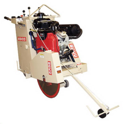 Concrete saw with red blade, beige frame, and gas engine, used for cutting concrete surfaces.