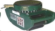 Green turntable with rollers, used for moving heavy objects.