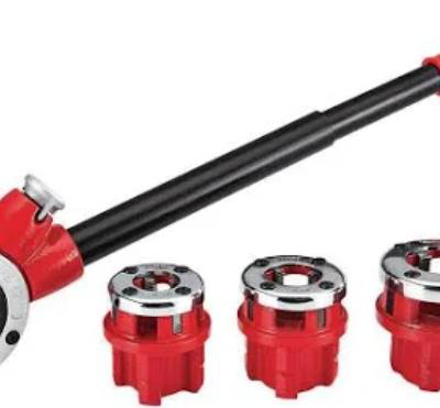 Red and black pipe threader tool with three red dies on white background.