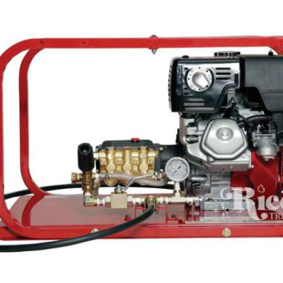 Red gas-powered pressure washer with black engine and brass components, mounted on a red frame.