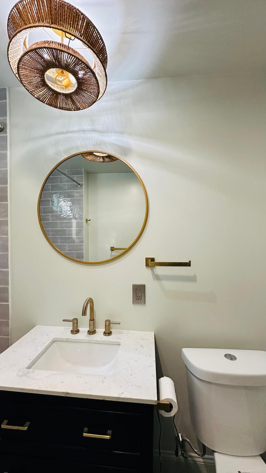 A beautiful bathroom with a sink, toilet, and mirror.