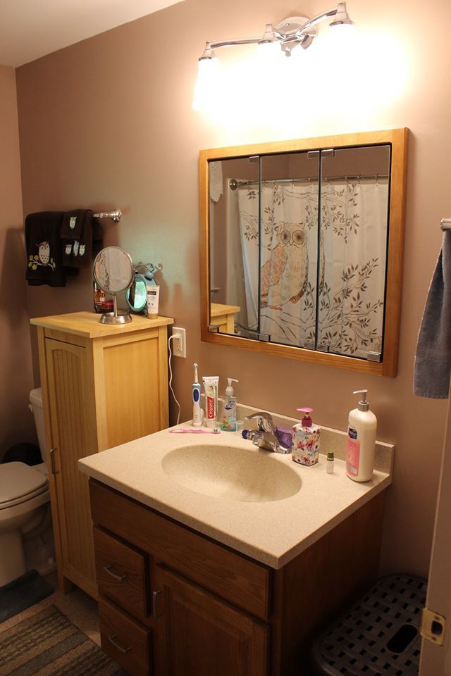 Bathroom with wooden cabinets