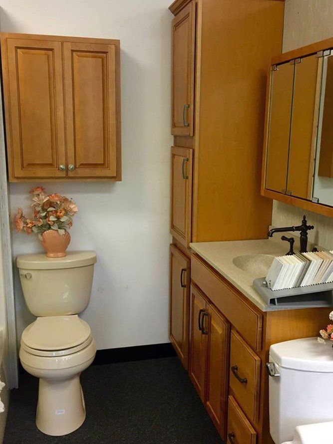 Light brown bathroom cabinets and sink