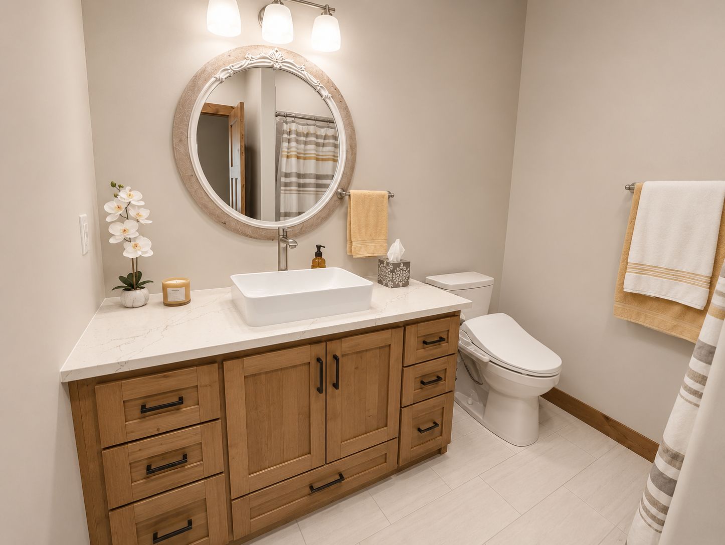Modern bathroom with wood vanity and round mirror