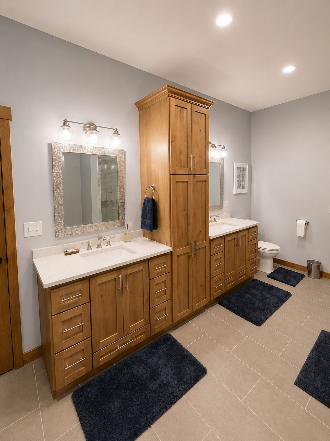 Bathroom with double wood vanities