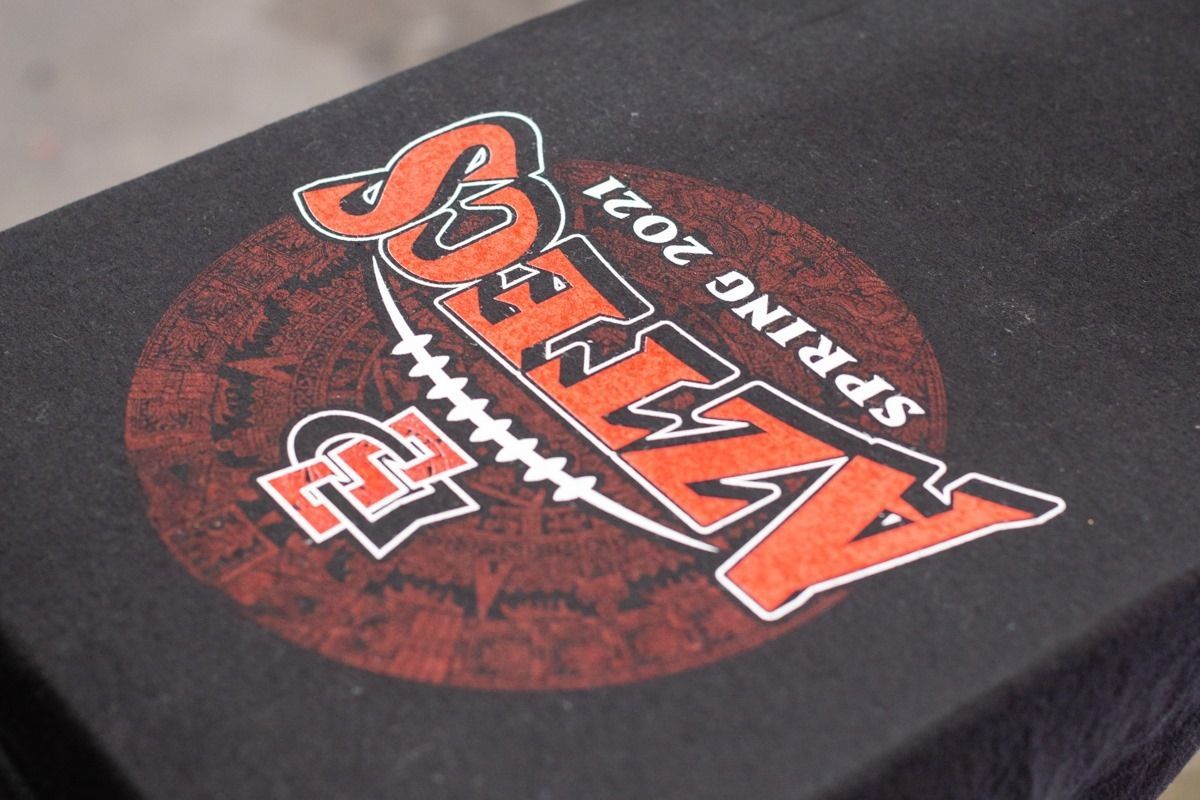 Black t-shirt with a red and white 