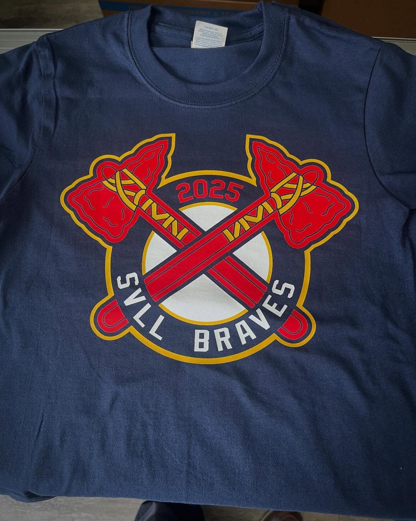 Navy blue t-shirt with a crossed ax logo. The logo has red axes, a white circle, and 