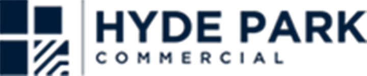 The logo for hyde park commercial is blue and white