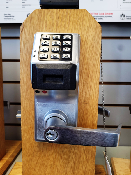 A door lock with a keypad on top of it