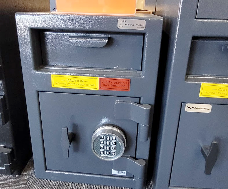 A safe with a digital lock and a drawer