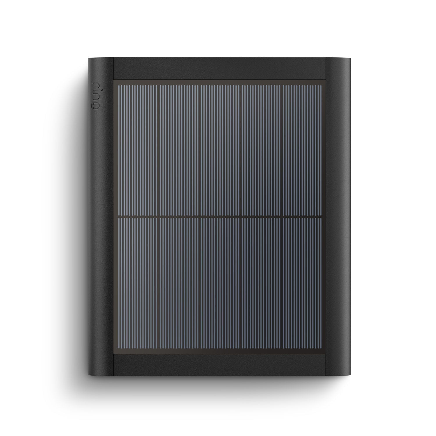 A black solar panel is sitting on top of a white surface.