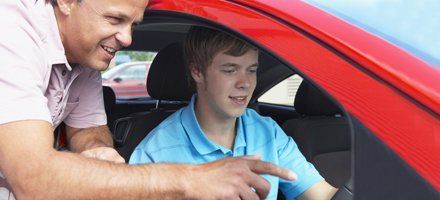 Teenage boy having driving lesson with instructor