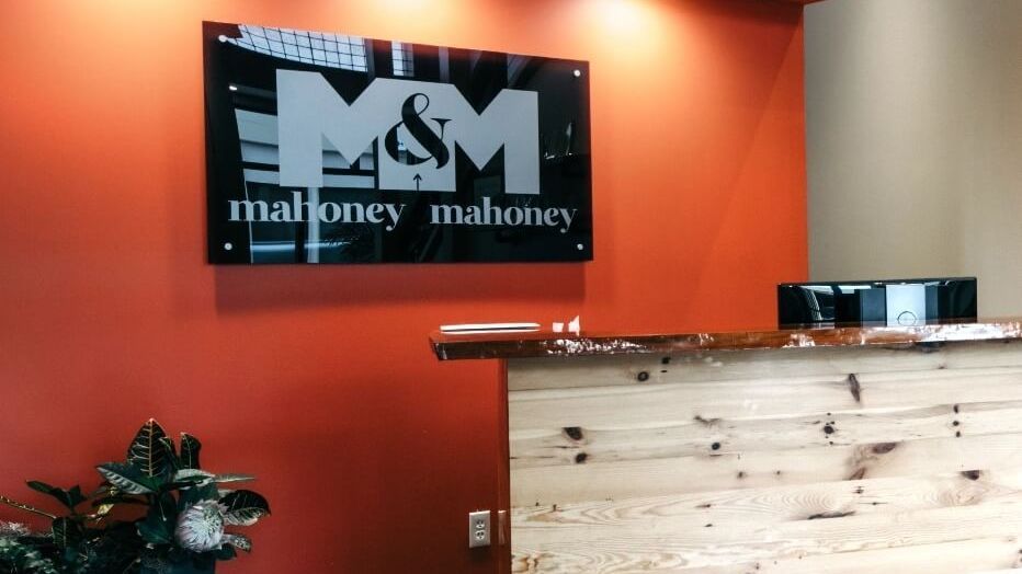 A reception area with a sign that says m & m on it