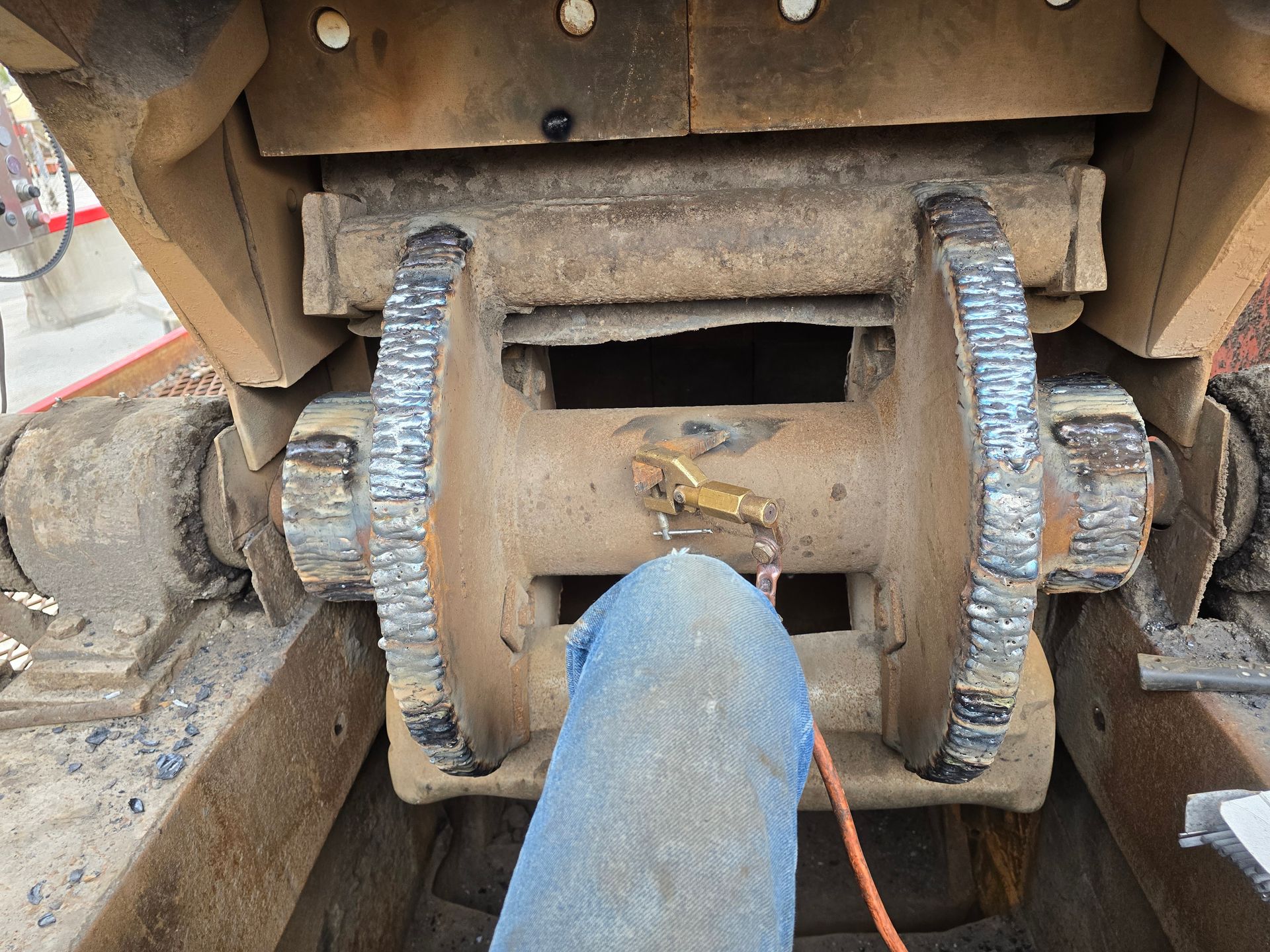 Close-up of a rusty industrial wheel assembly