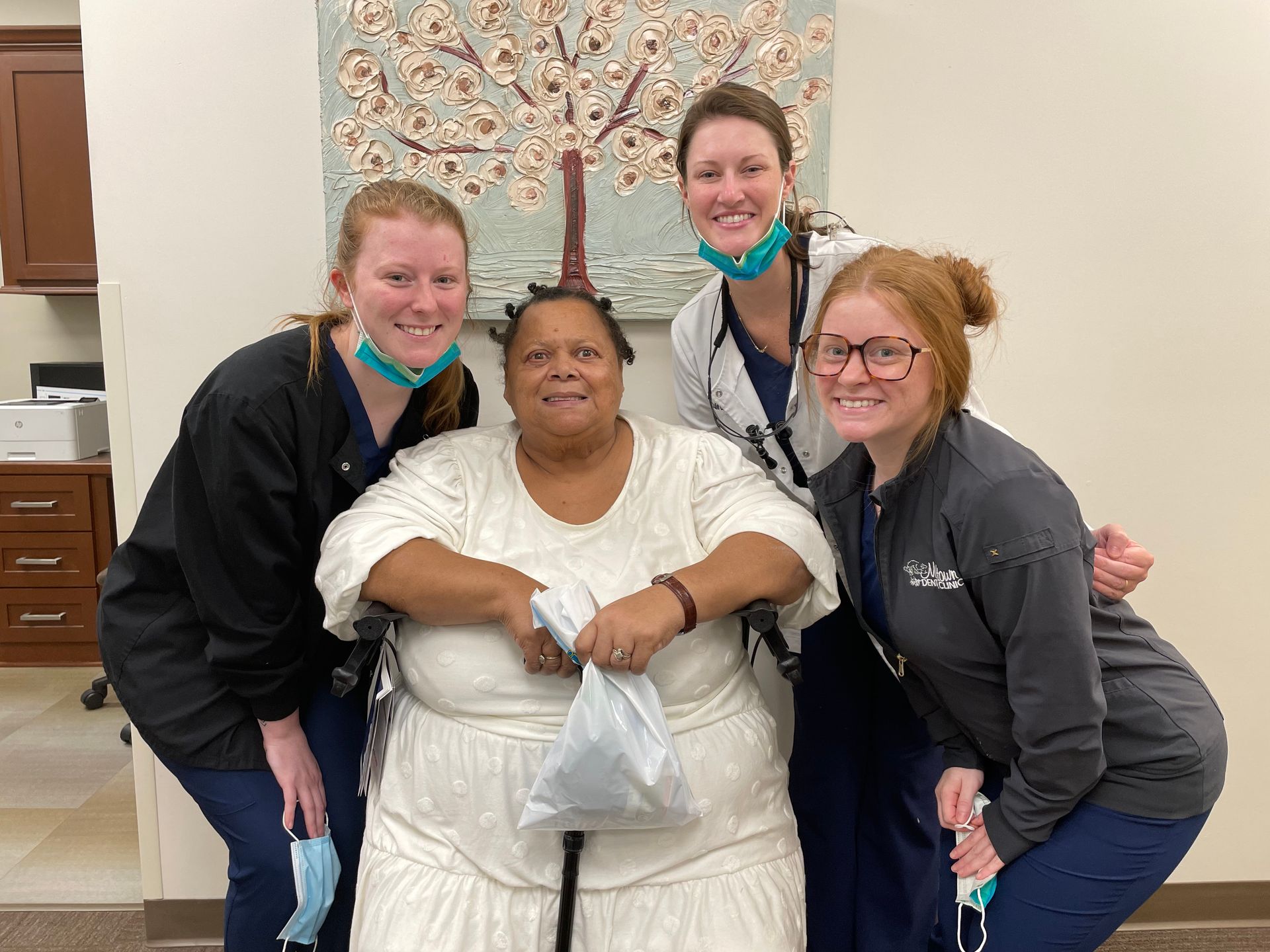 Midtown Dental Clinic staff with a patient