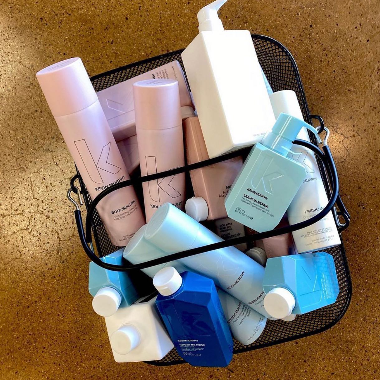 A basket full of hair products including kevin murphy