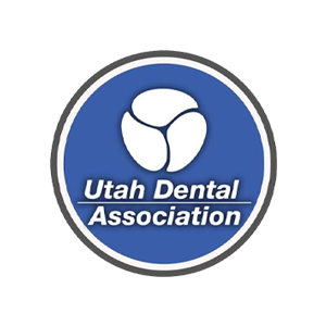 Utah Dental Association logo in a blue circular badge with a white tooth icon