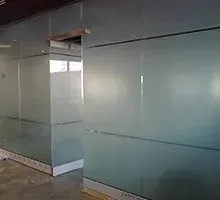 Frosted glass office walls, creating semi-private spaces.