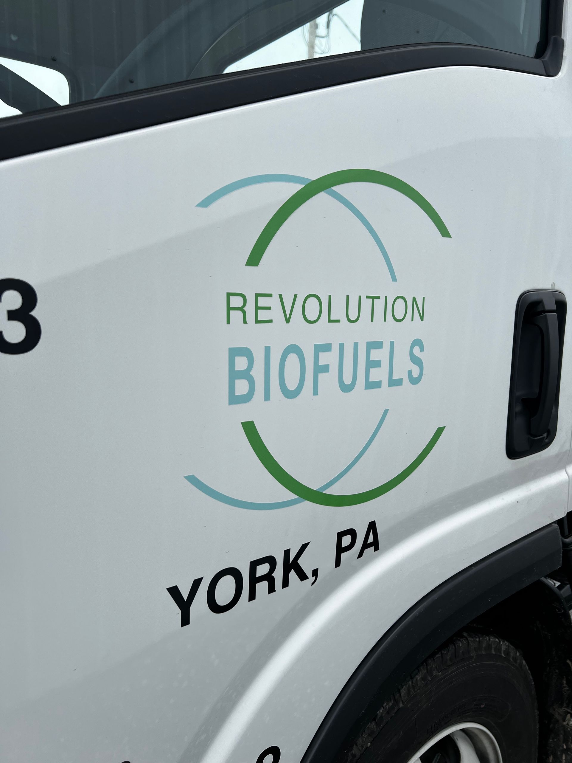 A white revolution biofuels truck is parked in york pa