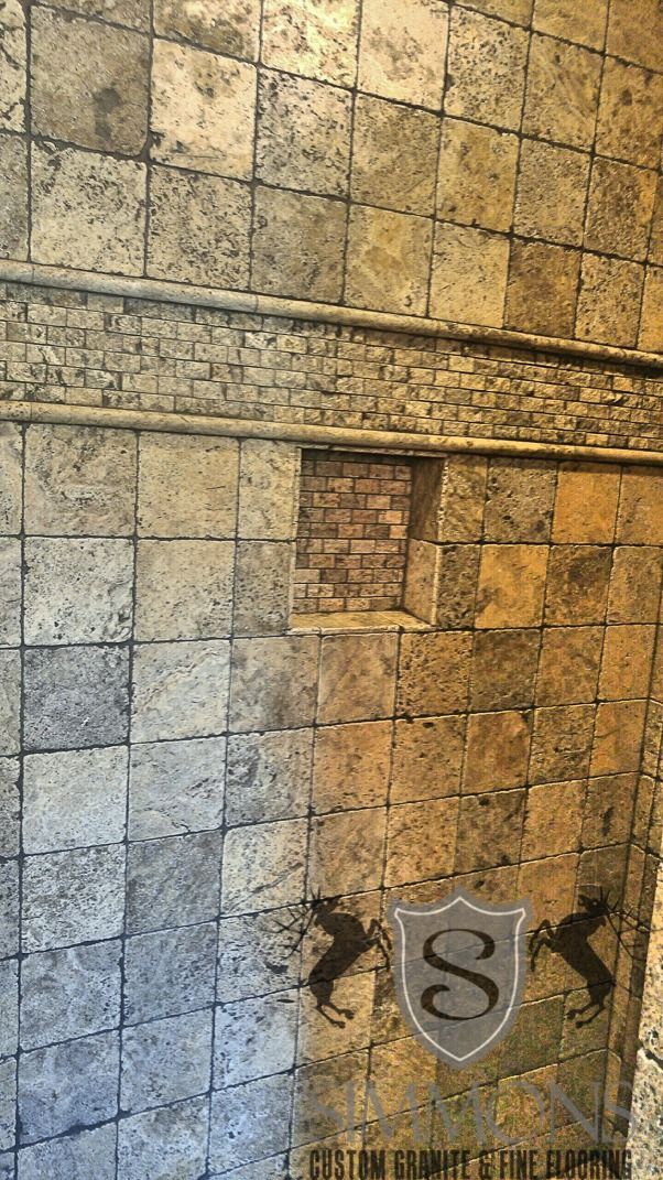 Stone wall with a small plaque marked “8” near the bottom center.