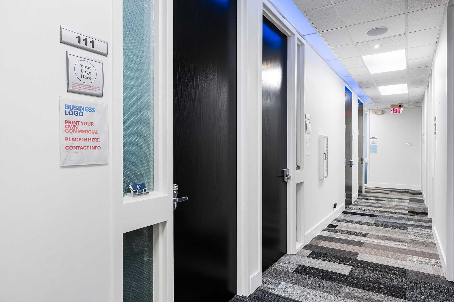Narrow hallway with doors, textured carpet, and overhead lighting. Room 111 is on the left.