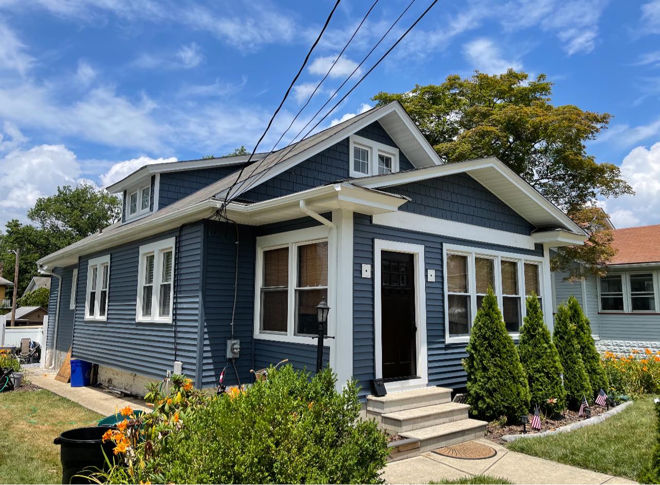 Blue house siding with white trim