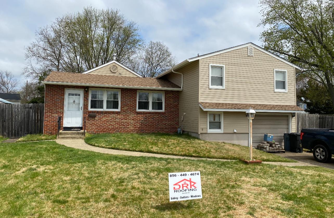 Cream siding with brick walls