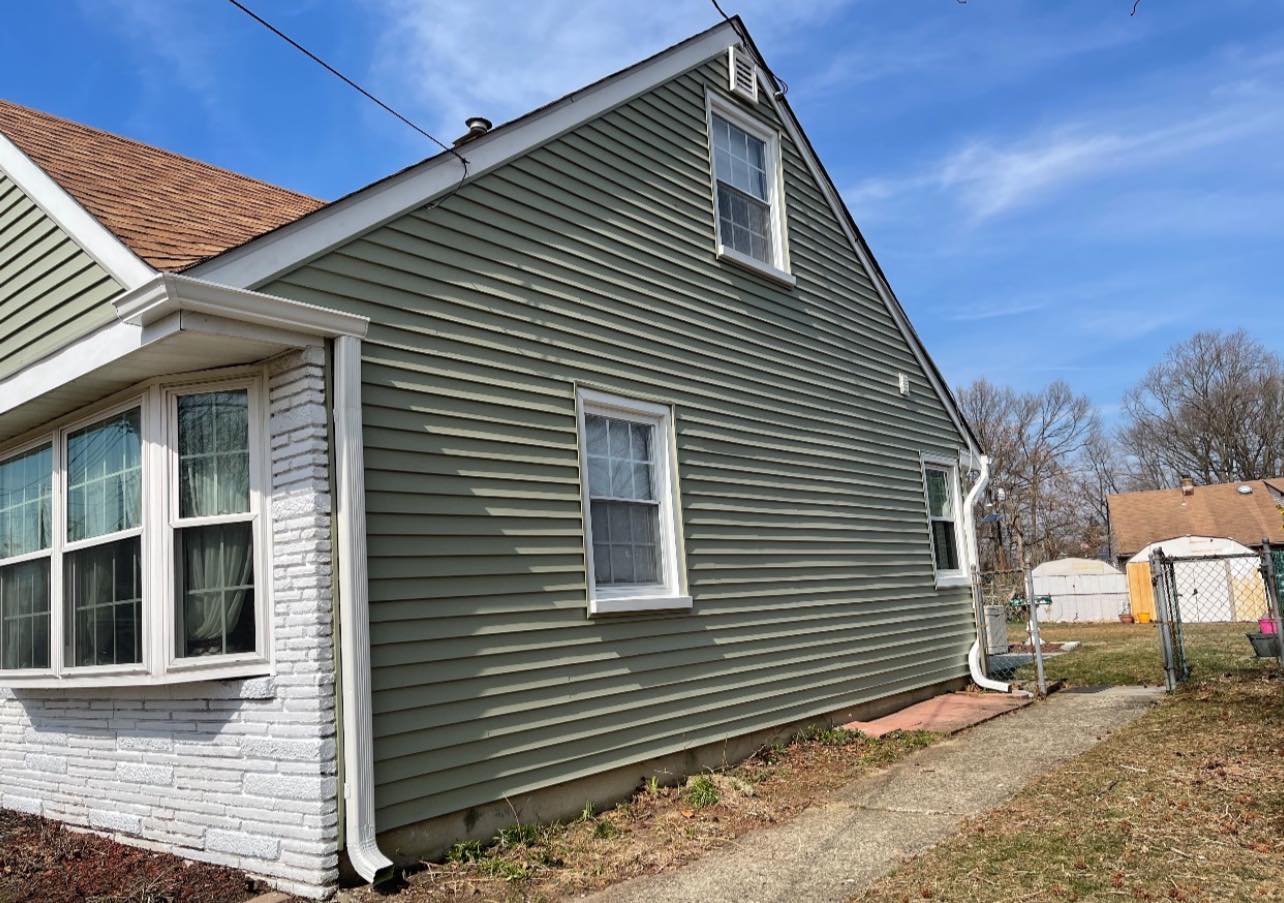 Gray siding with white brick walls