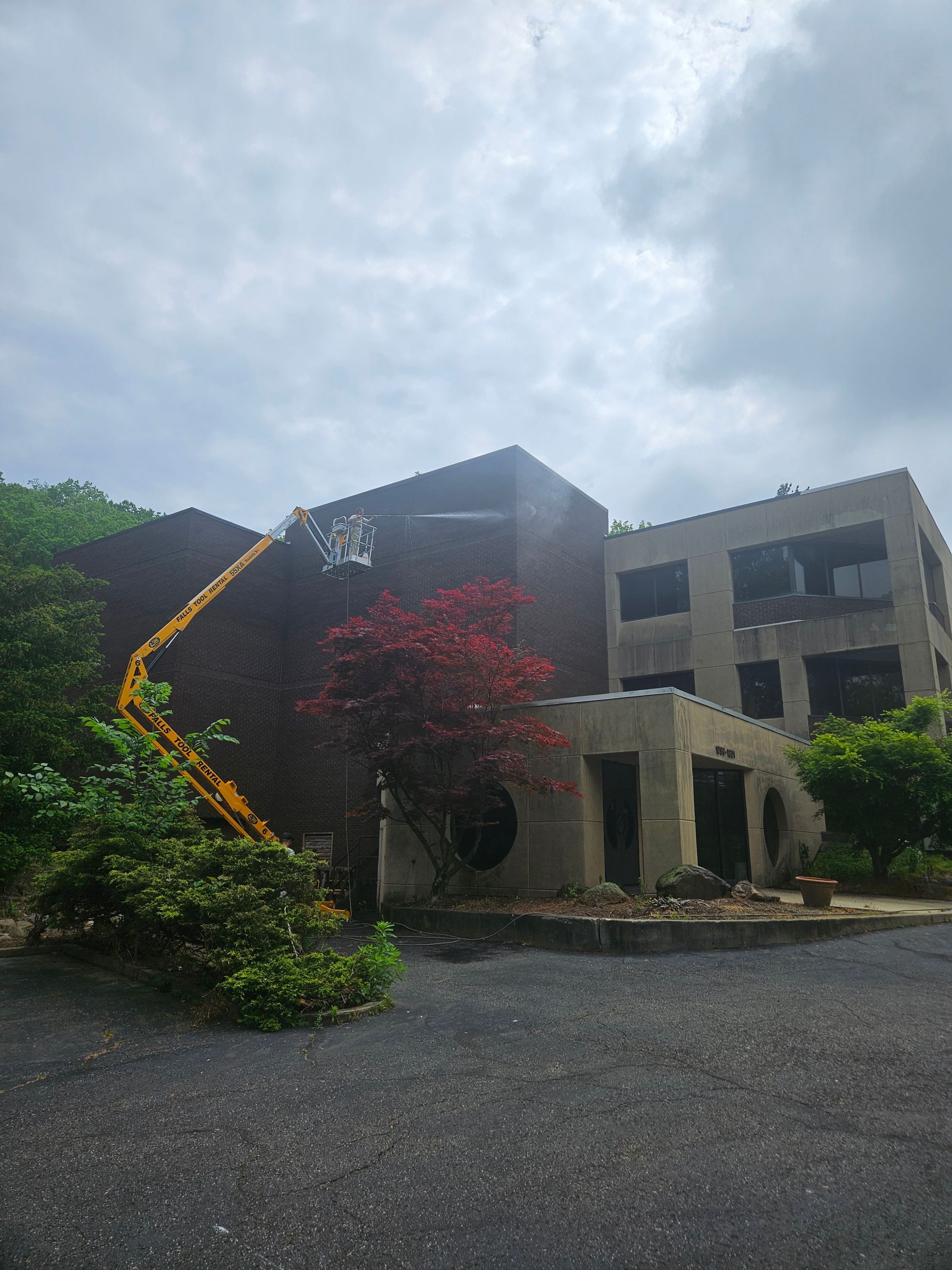 A large building with a crane on the side of it.