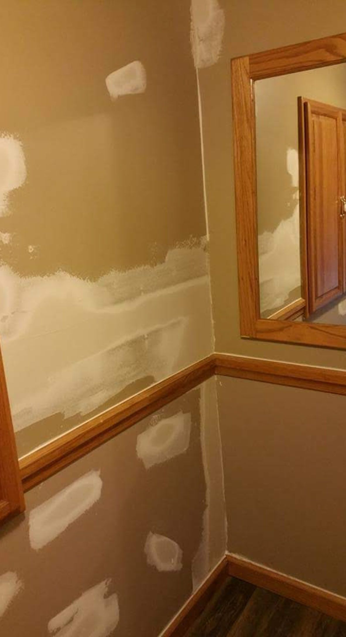 There is a mirror in the corner of the room.